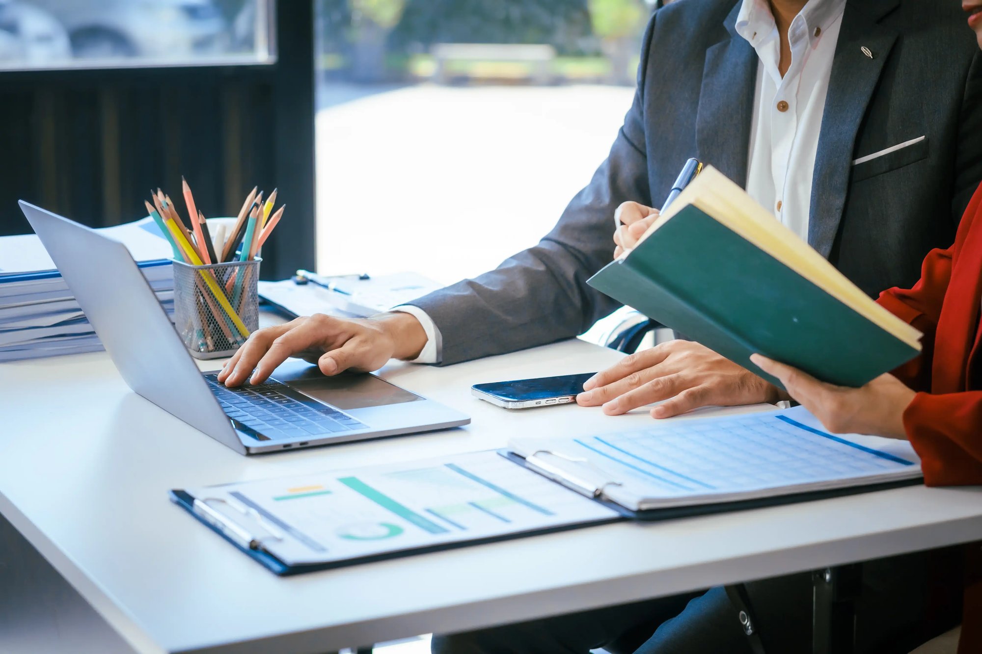 a-businessman-and-woman-sit-at-a-modern-office-tab-2025-02-15-20-26-00-utc