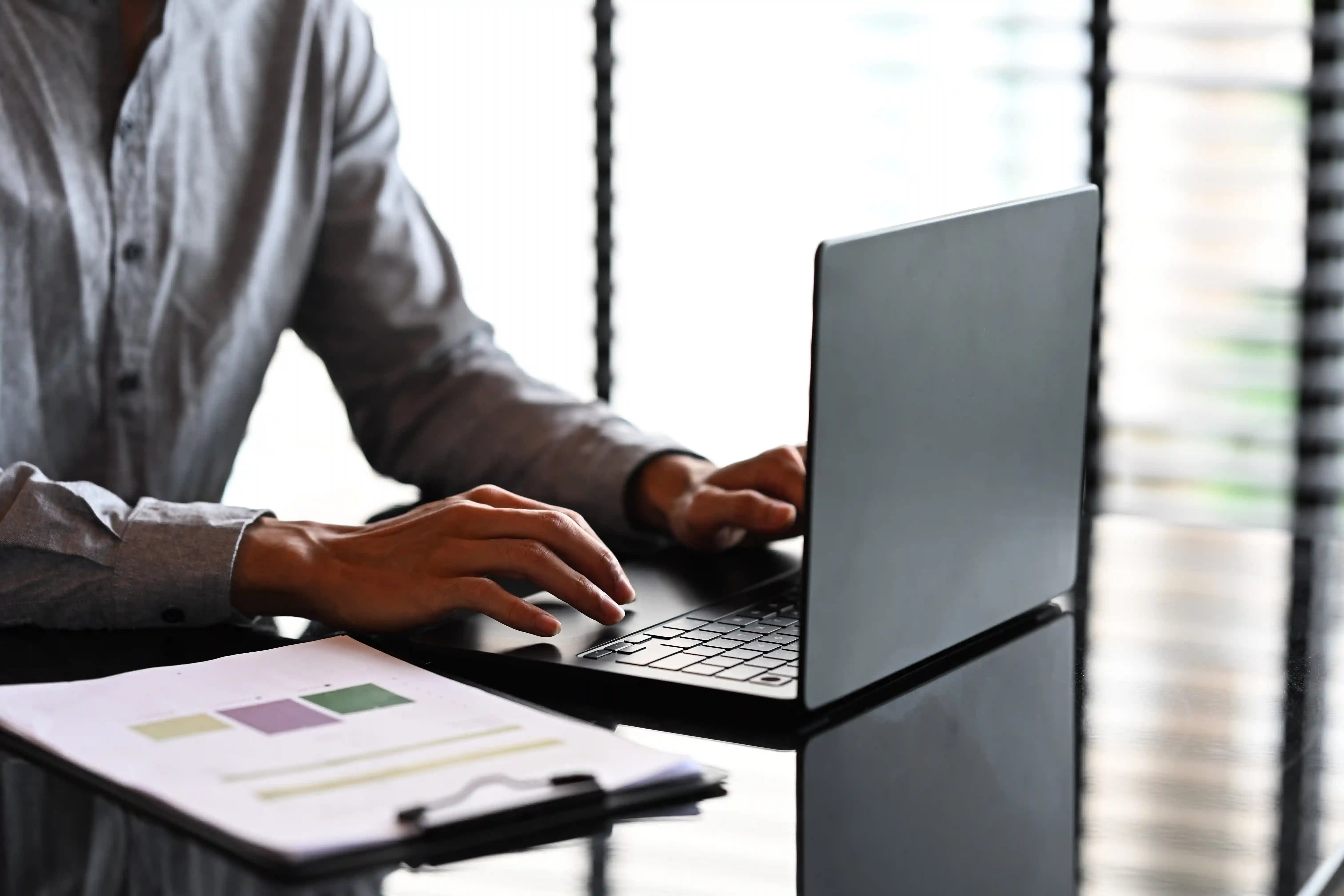 close-up-of-businessman-working-on-a-laptop-with-f-2025-08-27-14-10-17-utc