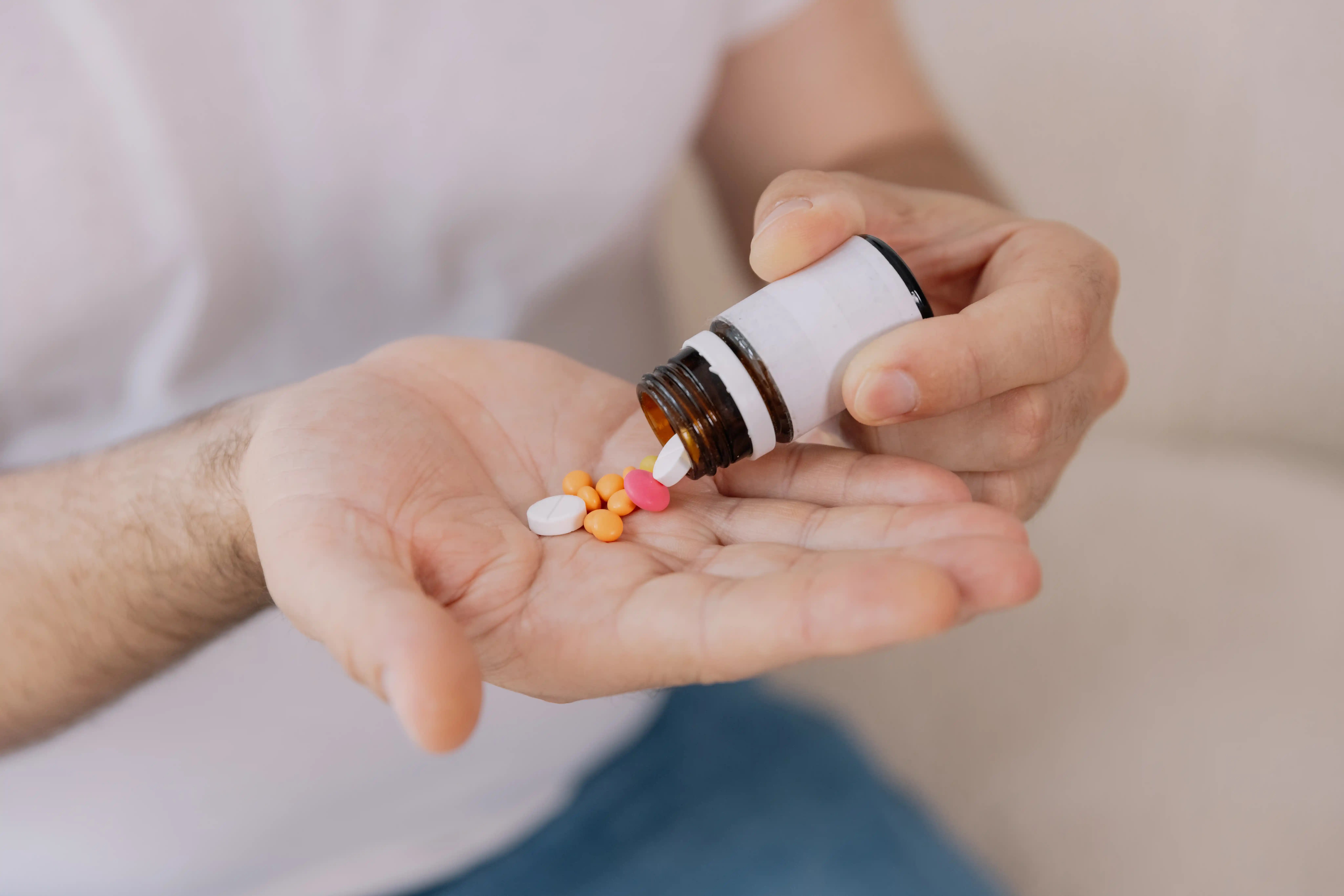 close-up-of-male-hands-holding-pills-mockup-copy-2026-03-18-21-21-25-utc-1